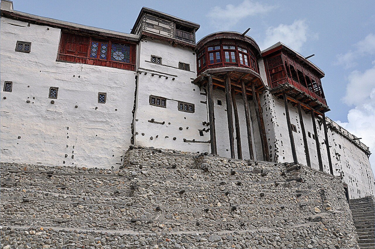 White stone walls and timber balconies of Baltit Fort in Hunza