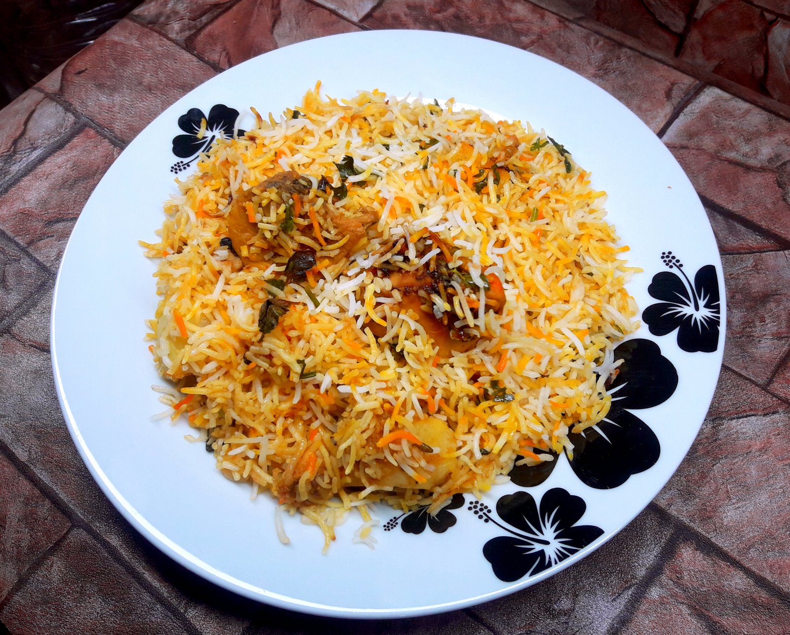 A plate of biryani photographed in Lahore, Pakistan