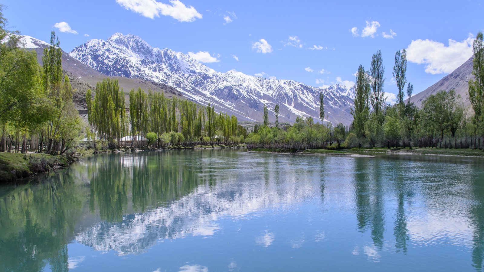 Phander Lake with snowy mountains and blue sky, Pakistan